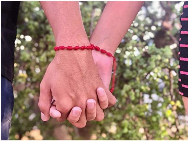 pulsera hilo rojo con 7 nudos para parejas